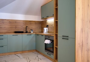 Exclusive Apartment, 3 Bedrooms | Private kitchen | Full-size fridge, oven, stovetop, electric kettle