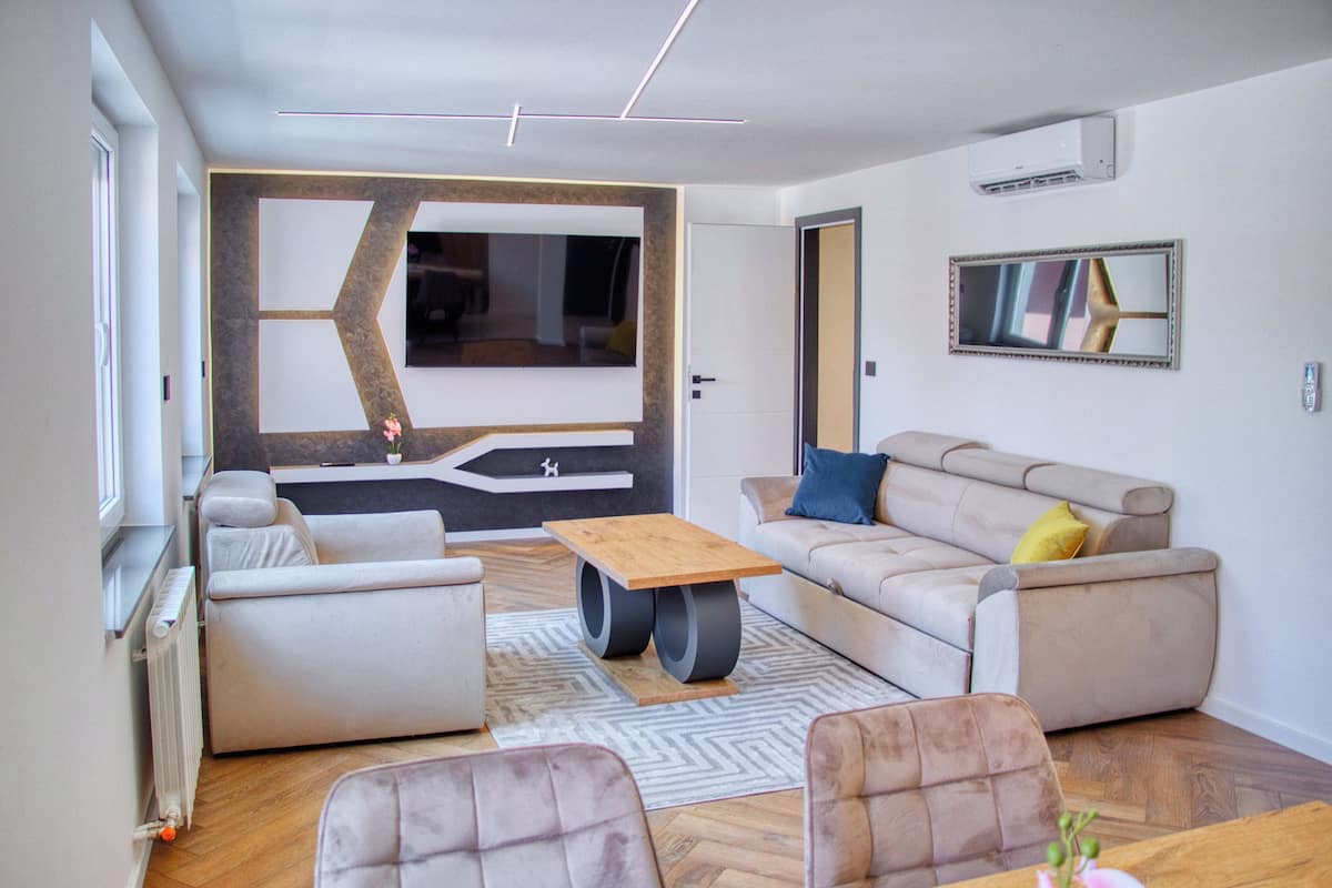 Exclusive Apartment, 2 Bedrooms | Living area | 43-inch LED TV with cable channels