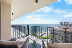 A balcony with a view of the ocean and a beach. - Rare Desirable Unit | Located in Shipps Landing III (Marco Island)