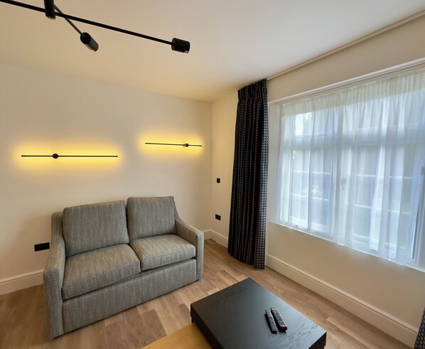 Superior Apartment, Non Smoking, Courtyard View | Living area | 43-inch Smart TV with digital channels