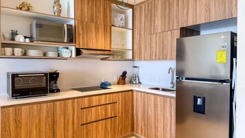 Fridge, microwave, stovetop, coffee/tea maker