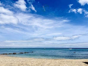 A beach with clear skies, calm sea, and distant sailboats. - Luxury Oceanview 2BR   La Cruz de Huanacaxtle (Cruz de Huanacaxtle)