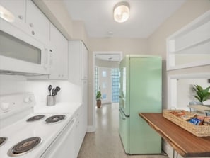 Fridge, microwave, stovetop, cookware/dishes/utensils