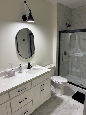 Shower, hair dryer, towels, soap