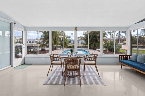 River House Retreat — Canal Views and Poolside Bliss!