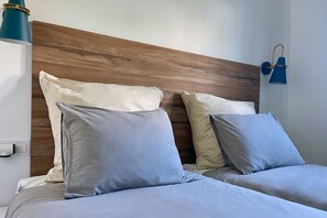 2 habitaciones, tabla de planchar con plancha, wifi y ropa de cama