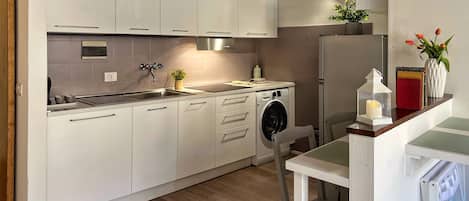 Fridge, stovetop, coffee/tea maker, cookware/dishes/utensils