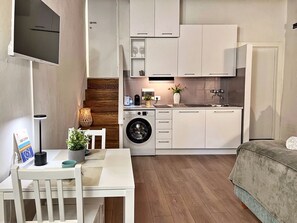 Fridge, stovetop, dishwasher, coffee/tea maker