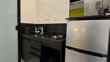 Apartment | Private kitchen | Fridge, microwave, stovetop, cookware/dishes/utensils