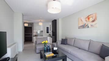 Deluxe Apartment, Balcony, City View | Living area | Computer monitors, printers