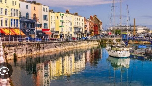 A waterfront hotel with multiple stories, a dock with boats, and a clear view of the water. - Pet Friendly, Top Floor Apt w/ Sea View, Sleeps 5 (Ramsgate)