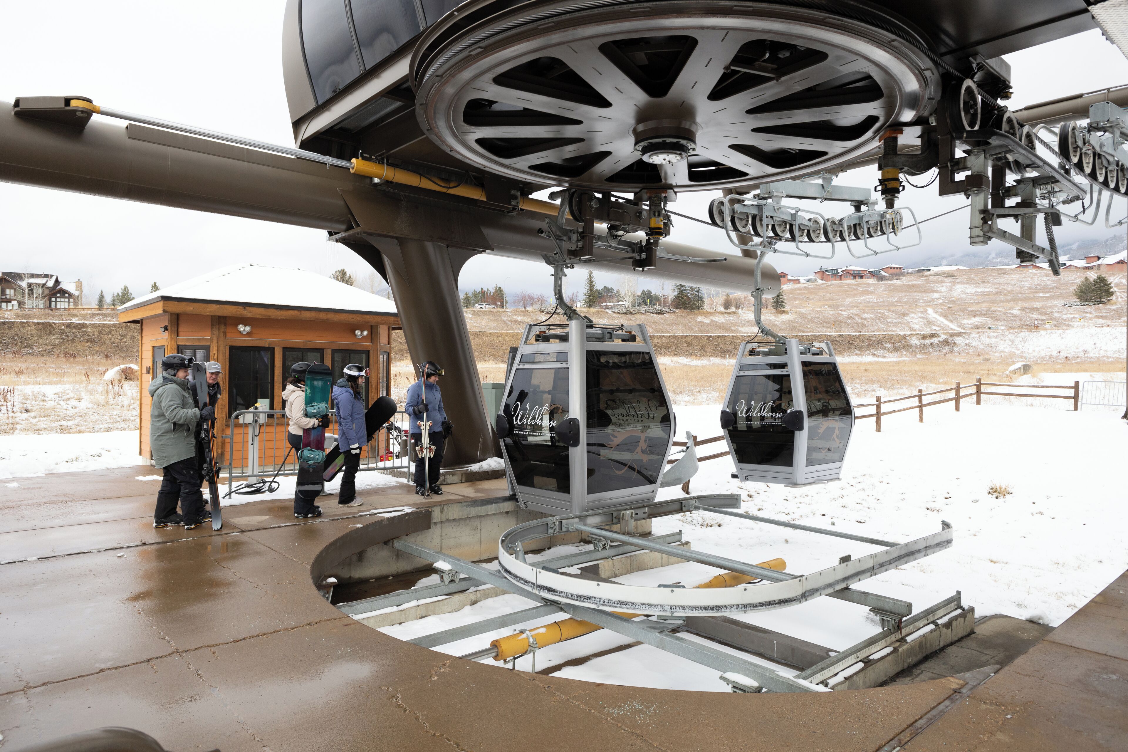 A ski lift with cabins and a control station.