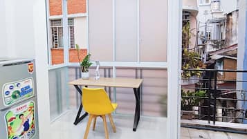 Deluxe Double Room, Kitchen, City View | Desk, iron/ironing board, free WiFi