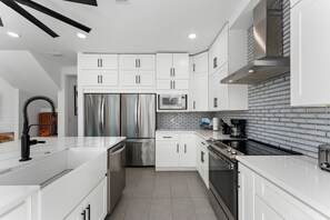 Fridge, microwave, oven, stovetop - Coastal Pool Paradise – 4BR Retreat Minutes from the Beach (Panama City Beach)