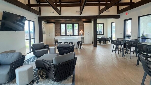 A spacious open-plan living area with a kitchen, dining area, and seating arrangements. - Family-Friendly 3BR Condo Sleeps 9, Ensuite Bathrooms (Oxford)