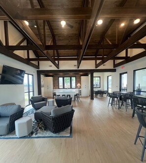 A spacious open-plan living area with a kitchen, dining area, and seating arrangements. - Family-Friendly 3BR Condo Sleeps 9, Ensuite Bathrooms (Oxford)