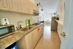 Fridge, microwave, stovetop, coffee/tea maker