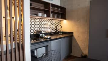 Fridge, microwave, stovetop, coffee/tea maker