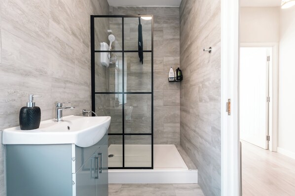 Shower, hair dryer, towels, soap