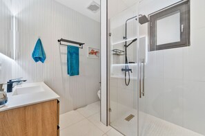Shower, hair dryer, towels, soap
