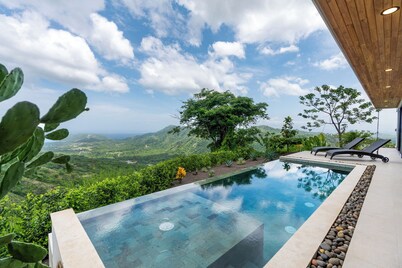 Mountainside Home with Modern Design, Sweeping Ocean Views & Private Swimming Pool