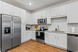 Coffee/tea maker, fridge, microwave, oven