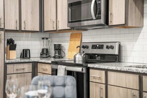Coffee/tea maker, fridge, microwave, oven