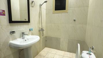Shower, slippers, towels, soap