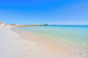 On the beach, sun-loungers, beach towels