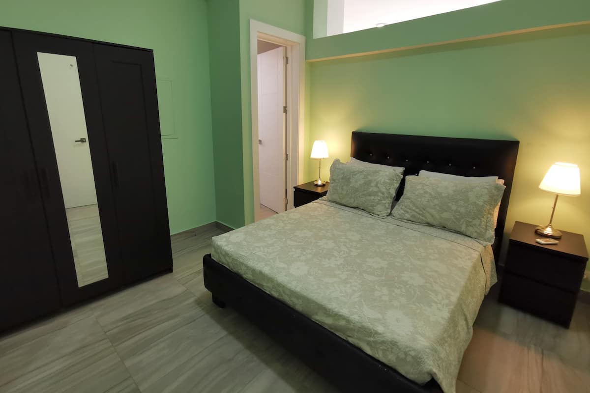 Deluxe Suite, City View | In-room safe, laptop workspace, blackout drapes, iron/ironing board