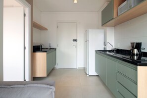 Full-sized fridge, cookware/dishes/utensils