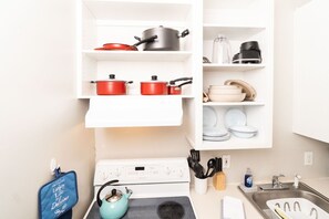 Fridge, stovetop, coffee/tea maker, cookware/dishes/utensils