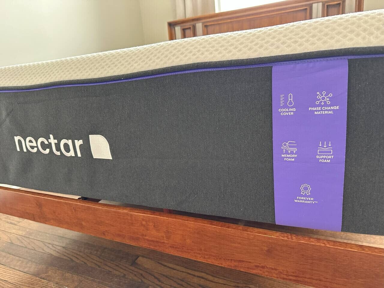 A Nectar mattress with a cooling cover, phase change material, memory foam, and support foam.