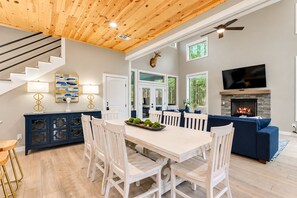 Open-concept dining connects seamlessly to the kitchen and living room - Kids Play Zones | Hot Tub | 3 Arcades | Family Fun (Broken Bow)