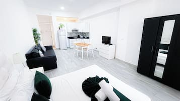 Executive Studio Suite, City View | Individually decorated, individually furnished, desk, iron/ironing board