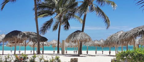 Beach nearby, white sand, sun loungers, beach umbrellas