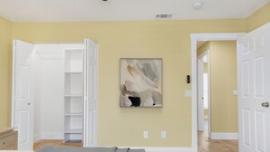 A bedroom with a bed, a closet, and a hallway leading to another room. - Zoo House Down Town Tampa (Tampa)
