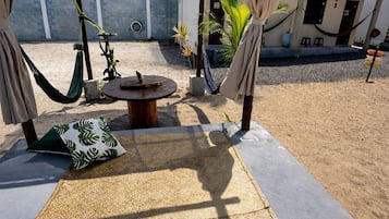 Family Quadruple Room, Garden View | Living area | 32-inch Smart TV with digital channels