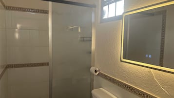 Shower, towels, soap, toilet paper