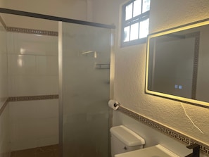 Shower, towels, soap, toilet paper