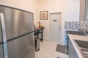Fridge, microwave, stovetop, coffee/tea maker