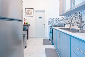 Fridge, microwave, stovetop, coffee/tea maker