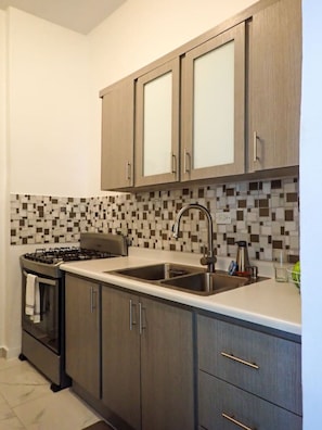 Fridge, microwave, stovetop, coffee/tea maker