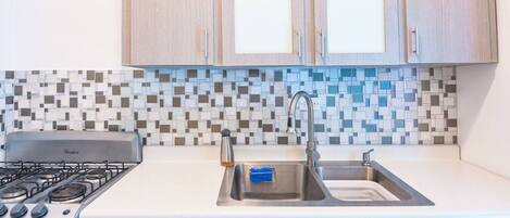 Fridge, microwave, stovetop, coffee/tea maker