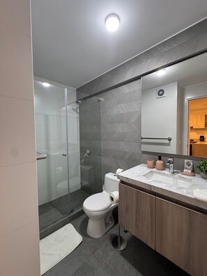 Shower, hair dryer, towels, soap