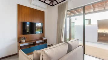 Basic Villa | Living area | 32-inch Smart TV with digital channels