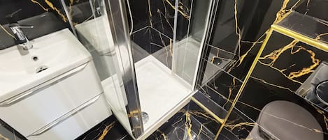 Shower, hair dryer, towels, soap