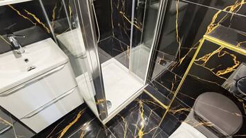 Shower, hair dryer, towels, soap
