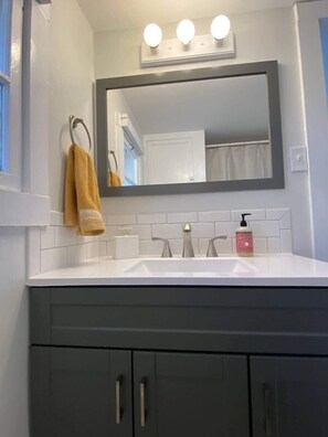 Shower, hair dryer, towels