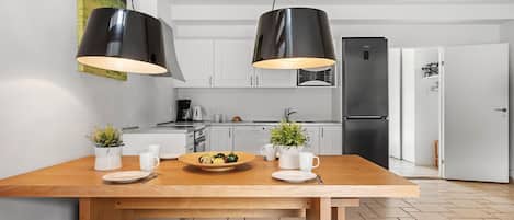 Fridge, stovetop, dishwasher, coffee/tea maker
